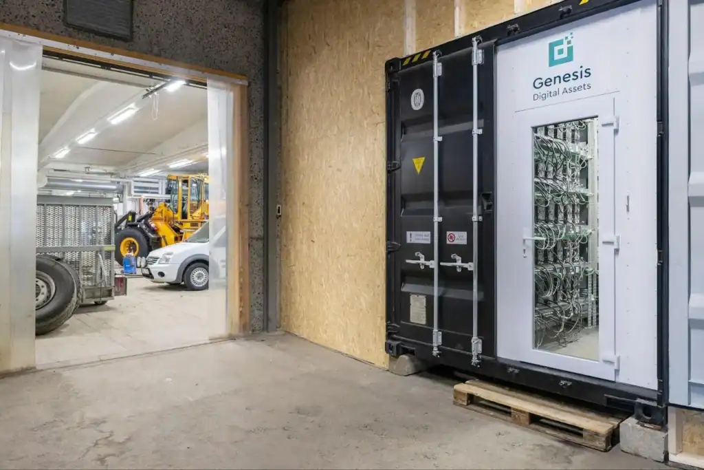 GDA mining container beside the garage it supplies with recovered heat