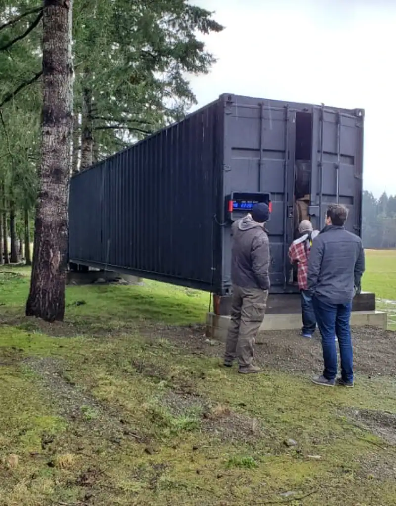 Project team beside the MintGreen container